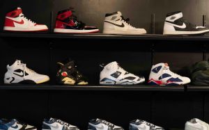 From vintage to unique collaborations, various Nike and Jordan shoes are displayed on a wall at Saved Soles inside West Ridge Mall.