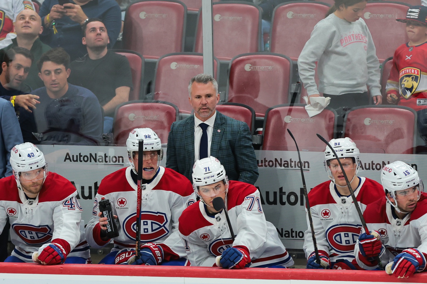 Dec 28, 2024; Sunrise, Florida, USA; Montreal Canadiens head coach Martin St-Louis watches from the bench against the Florida Panthers during the third period at Amerant Bank Arena.