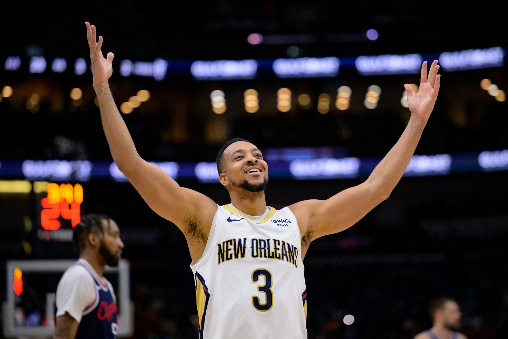 Mar 11, 2025; New Orleans, Louisiana, USA; New Orleans Pelicans guard CJ McCollum (3) reacts after a three-point basket against the Los Angeles Clippers during the fourth quarter at Smoothie King Center.