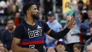 Mar 15, 2025; Detroit, Michigan, USA; Detroit Pistons guard Malik Beasley (5) celebrates in the first half against the Oklahoma City Thunder at Little Caesars Arena.