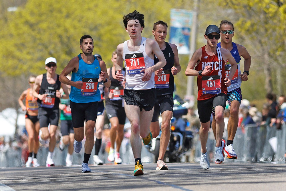 A pack of runners during the 129th running of the Boston Marathon at Heartbreak Hill in Newton, April 21, 2025.