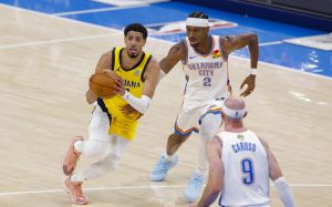 Jun 5, 2025; Oklahoma City, Oklahoma, USA; Indiana Pacers guard Tyrese Haliburton (0) passes the ball past Oklahoma City Thunder guard Shai Gilgeous-Alexander (2) during the second quarter during game one of the 2025 NBA Finals at Paycom Center.