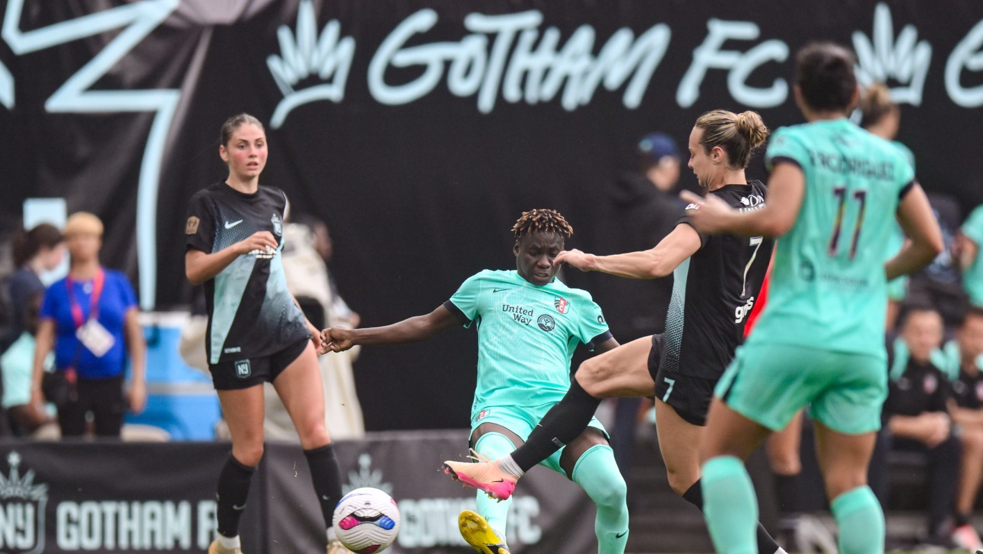 Jun 7, 2025; Harrison, New Jersey, USA; Kansas City Current forward Flora Marta Lacho (30) passes the ball as NJ/NY Gotham FC midfielder Jaelin Howell (7) defends during the second half at Sports Illustrated Stadium.