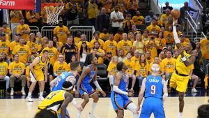 Jun 11, 2025; Indianapolis, Indiana, USA; Indiana Pacers guard Bennedict Mathurin (00) shoots the ball against Oklahoma City Thunder guard Alex Caruso (9) in game three of the 2025 NBA Finals at Gainbridge Fieldhouse.