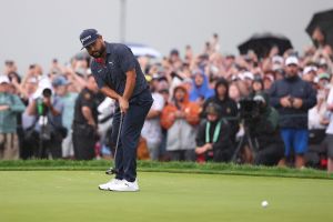 Jun 15, 2025; Oakmont, Pennsylvania, USA; JJ Spaun putts on the 18th green to win during the final round of the U.S. Open golf tournament.