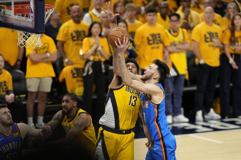 Jun 19, 2025; Indianapolis, Indiana, USA; Oklahoma City Thunder forward Chet Holmgren (7) shoots the ball against Indiana Pacers center Tony Bradley (13) during the first half of game six of the 2025 NBA Finals between the Oklahoma City Thunder and the Indiana Pacers at Gainbridge Fieldhouse.