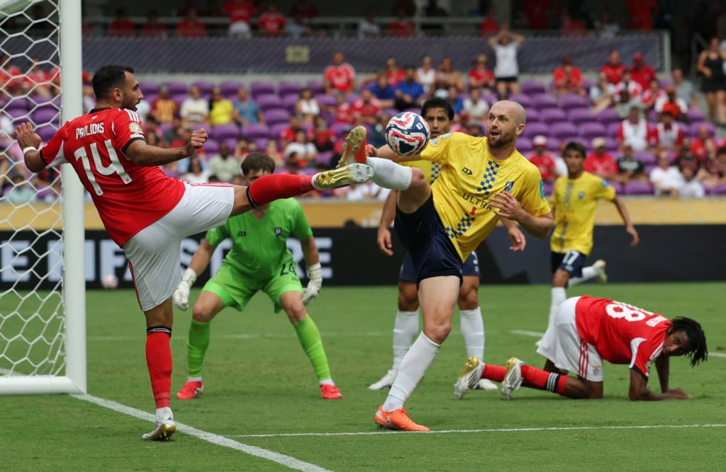 Jun 20, 2025; Orlando, Florida, USA; SL Benfica forward Evangelos Pavlidis (14) in action with Auckland City FC defender Christian Gray (4) during a group stage match of the 2025 FIFA Club World Cup at Inter&Co Stadium.