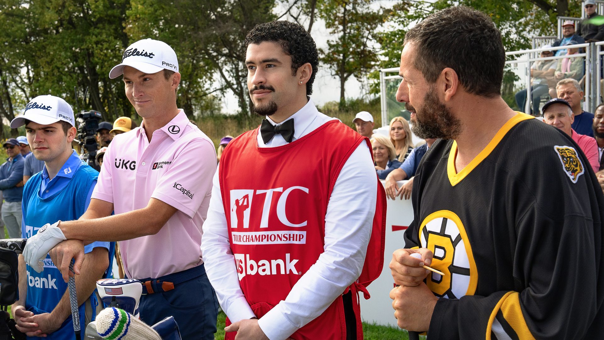 HAPPY GILMORE 2. (L to R) Quin Stiller as Will Zalatoris Caddie, Will Zalatoris as Himself, Benito Antonio Martínez Ocasio as Oscar Mejias and Adam Sandler as Happy Gilmore in Happy Gilmore2.