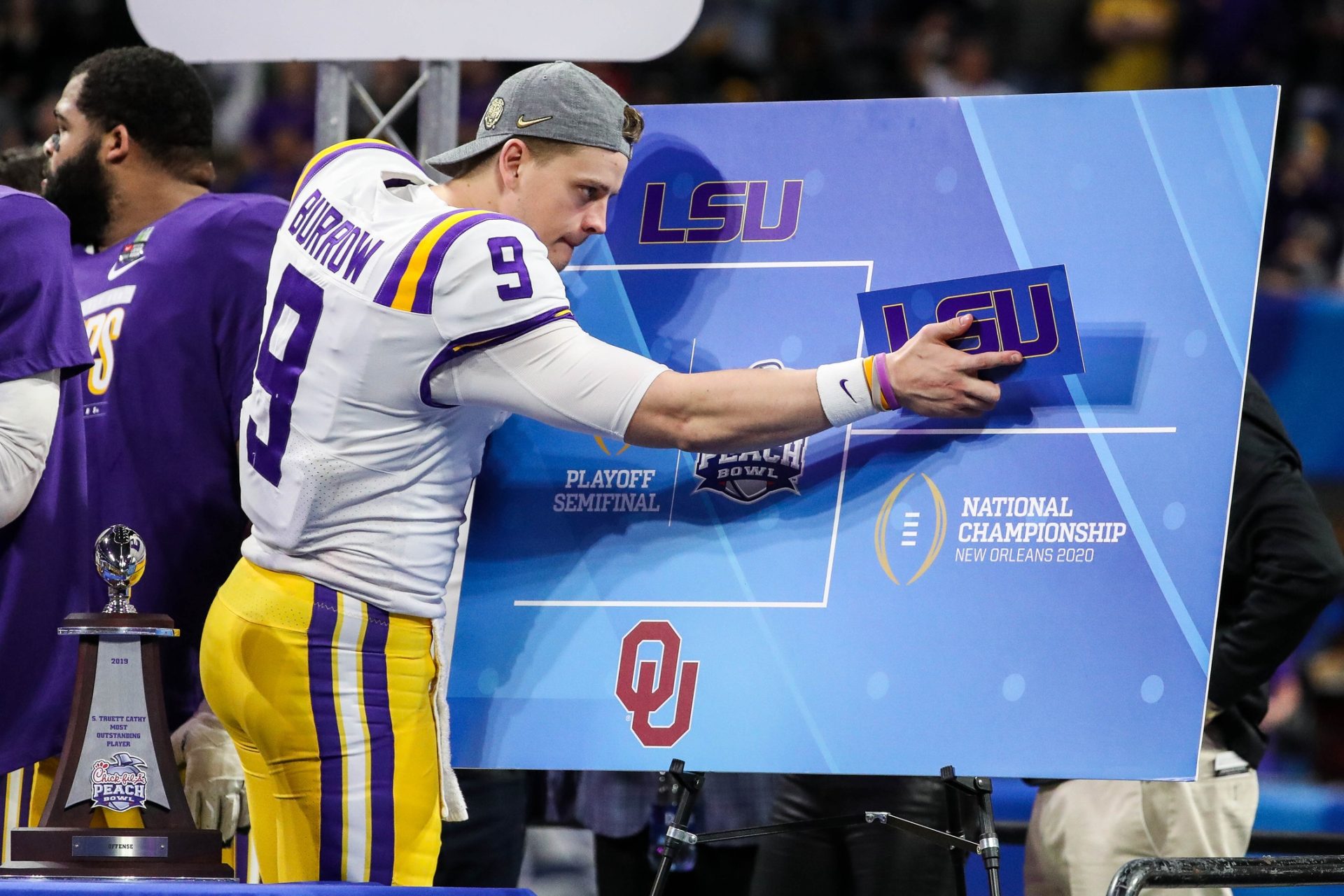 Dec 28, 2019; Atlanta, Georgia, USA; LSU Tigers quarterback Joe Burrow (9) fills out a bracket after the 2019 Peach Bowl college football playoff semifinal game between the LSU Tigers and the Oklahoma Sooners at Mercedes-Benz Stadium.