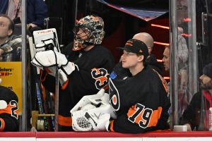 Jan 21, 2024; Philadelphia, Pennsylvania, USA; Philadelphia Flyers goaltender Samuel Ersson (33) and goaltender Carter Hart (79) watch from the bench against the Ottawa Senators during the third period at Wells Fargo Center.