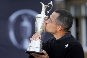 Jul 21, 2024; Ayrshire, SCT; Xander Schauffele celebrates with Claret Jug after winning the Open Championship golf tournament at Royal Troon.