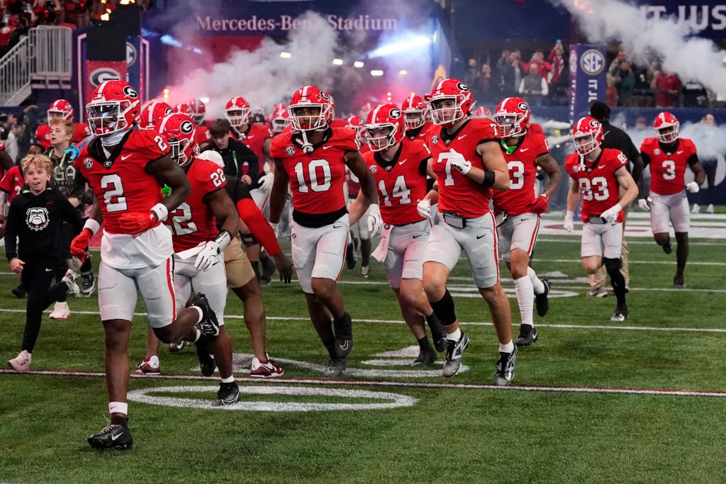 Georgia takes the field for the first half of the SEC championship game against Texas in Atlanta, on Saturday, Dec. 7, 2024.