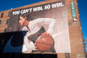 Nike banners featuring Caitlin Clark are installed along the eastern side of Des Moines' Court Avenue Restaurant and Brewing Company on Thursday, Feb. 20, 2025.