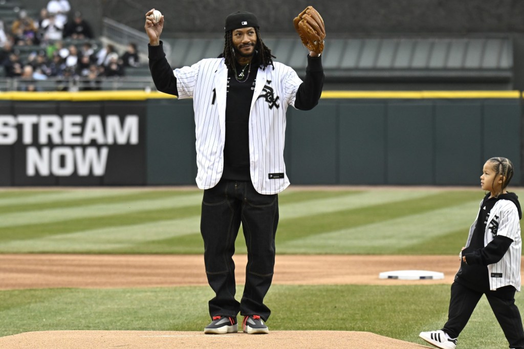 Mar 27, 2025; Chicago, Illinois, USA;  Former Chicago Bulls player Derrick Rose throws out a ceremonial first pitch during the Chicago White Sox Opening day ceremony at Guaranteed Rate Field.