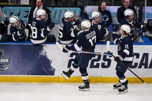 Louis, Missouri, UNITED STATES; Penn State Nittany Lions forward Nicholas DeGraves (17) celebrates with teammates after scoring a goal against the Boston University Terriers during the third period of the Frozen Four college ice hockey national semifinals at Enterprise Center