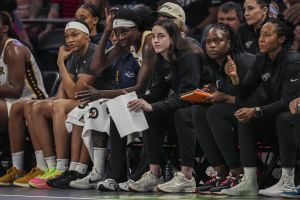 Jun 10, 2025; College Park, Georgia, USA; Indiana Fever injured guard Caitlin Clark (22) follows the action from the bench against the Atlanta Dream during the second half at Gateway Center Arena at College Park.