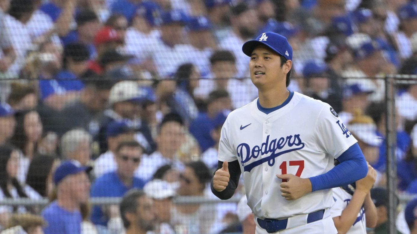 Jul 2, 2025; Los Angeles, California, USA; Los Angeles Dodgers two-way player Shohei Ohtani (17) heads to the dugout prior to the first inning against the Chicago White Sox at Dodger Stadium.