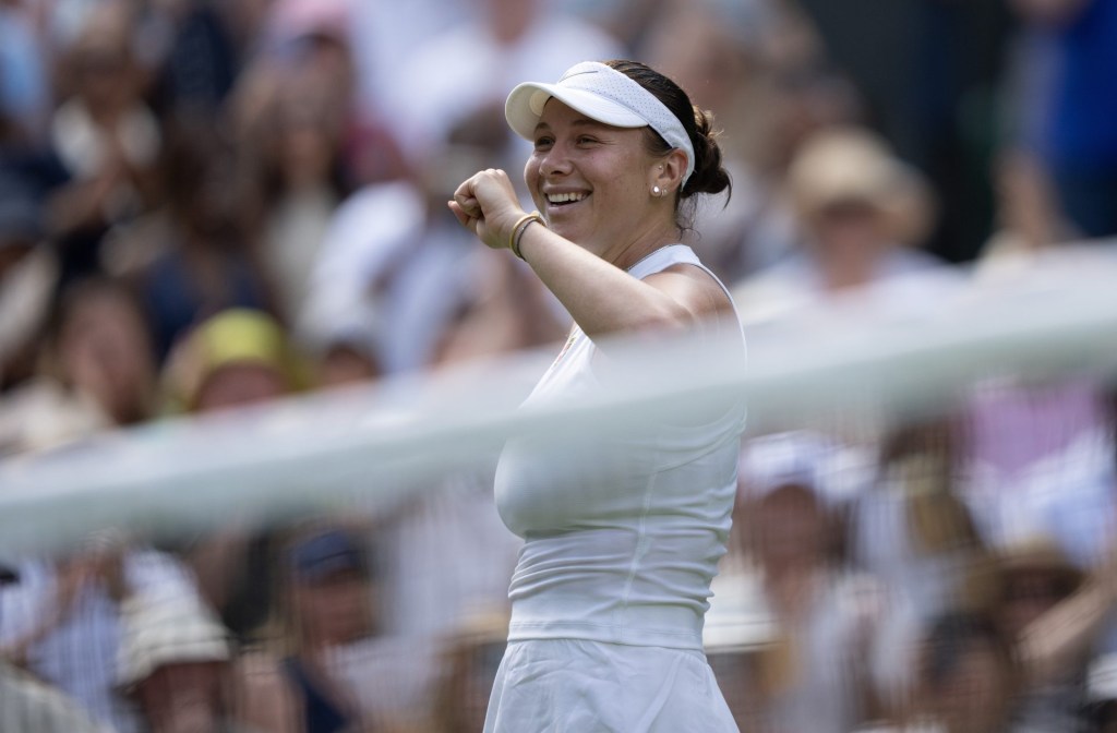 Jul 10, 2025; Wimbledon, United Kingdom; Amanda Anisimova of the United States celebrates winning her match against Aryna Sabalenka on day 11 at All England Lawn Tennis and Croquet Club.