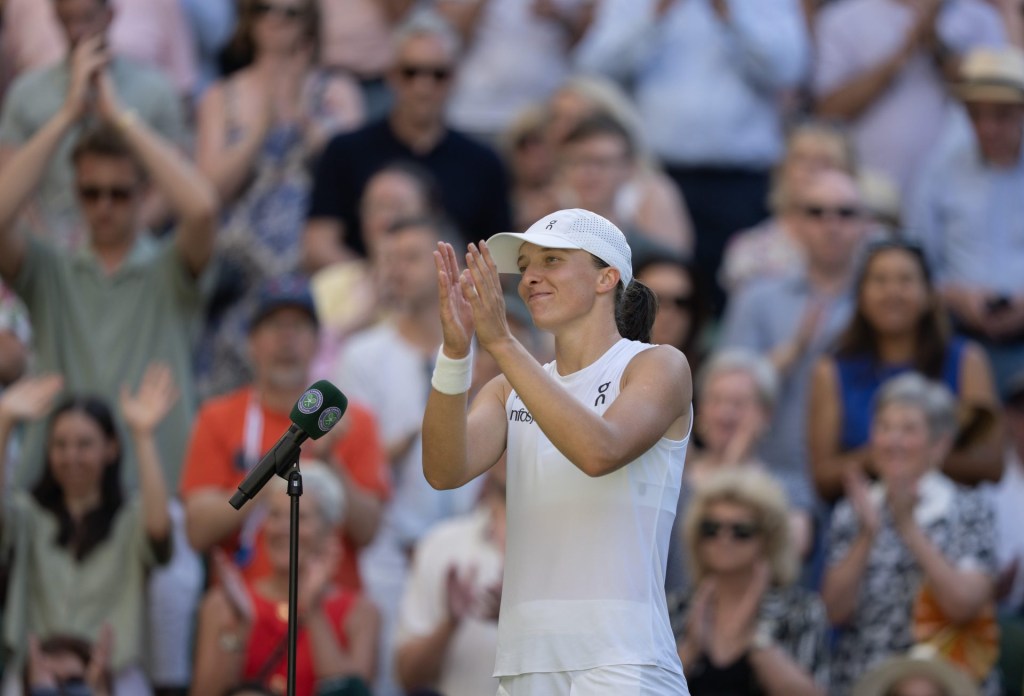 Jul 10, 2025; Wimbledon, United Kingdom; Iga Swiatek of Poland at her on court interview after winning her match against Belinda Bencic of Switzerland on day 11 at All England Lawn Tennis and Croquet Club.