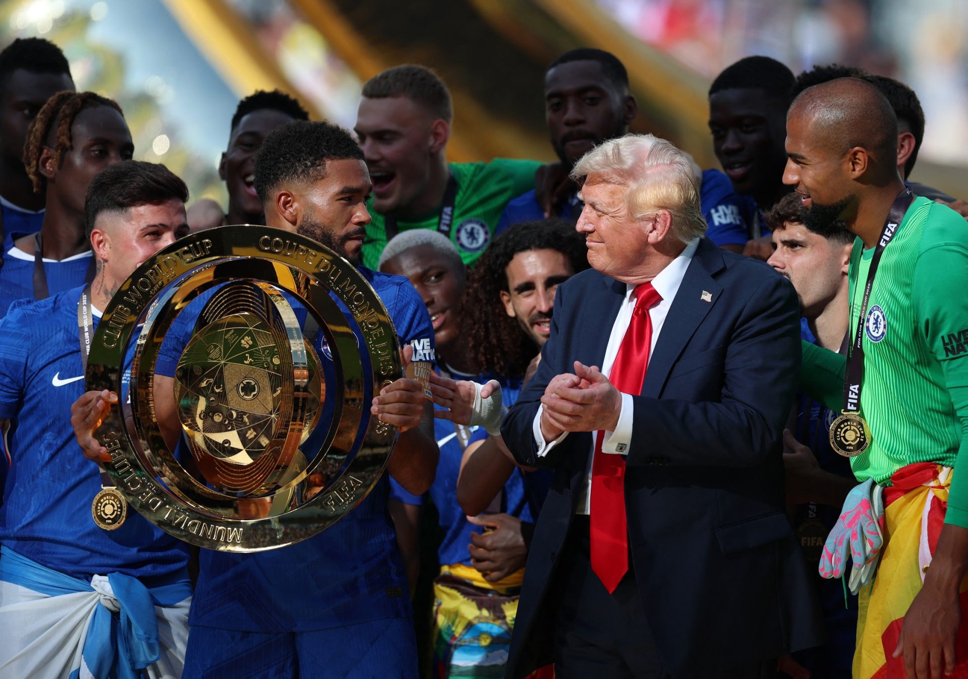 [Subscription Customers Only] Jul 13, 2025; East Rutherford, New Jersey, USA; Chelsea FC defender Reece James (24) lifts the trophy as he celebrates with teammates as U.S. president Donald Trump after the final of the 2025 FIFA Club World Cup at MetLife Stadium.