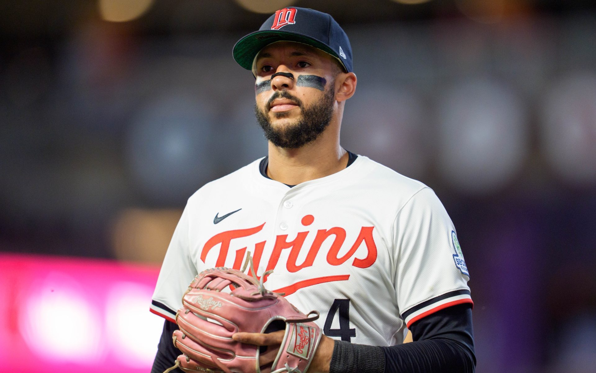 Jul 26, 2025; Minneapolis, Minnesota, USA; Minnesota Twins shortstop Carlos Correa (4) walks to the dugout after the ninth inning against the Washington Nationals at Target Field.