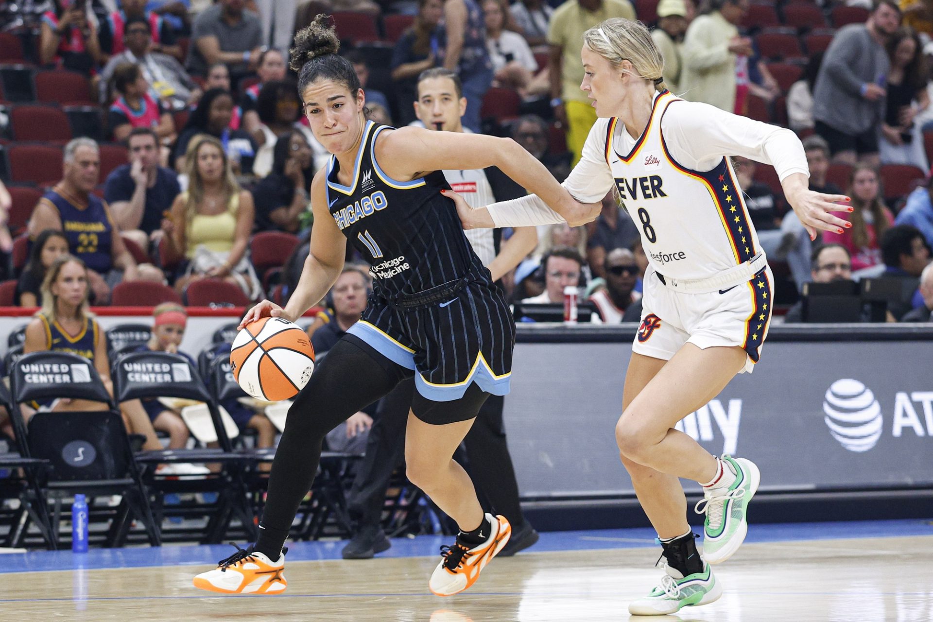 Jul 27, 2025; Chicago, Illinois, USA; Chicago Sky guard Kia Nurse (11) drives to the basket against Indiana Fever guard Sophie Cunningham (8) during the second half at United Center.