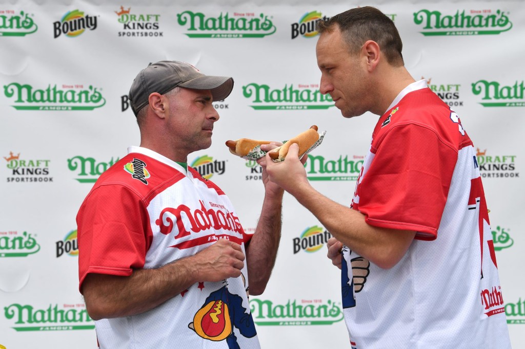 Nathan’s Weigh In.
Friday, July 2, 2021
The official Weigh In ceremony for Nathan’s Famous Fourth of July International Hot Dog Eating Championship was held at the Hudson Yards Plaza in Manhattan at 11AM.
The competitors included the defending men’s champion Joey “JAWS” Chestnut and women’s competition odds-on favorite Michele Lesco.
Last Year women’s champion Miki Sudo who is 8th month pregnant was on hand to support her boyfriend Nick Wehry who will compete in the men’s competition.
The event will be hosted on Sunday July 4th at MaimonidesPark in Coney Island Brooklyn in front of live audience after last year pause due to COVID-19.
For weigh-in stats;
Men’s Joey Chestnut 242 lb, Geoffrey Esper 187 lb,
Women’s Michele Lesco 112 1/2 lb, Sarah Rodriguez 143 lb.