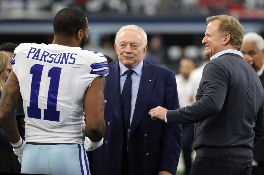 Jan 16, 2022; Arlington, Texas, USA; Dallas Cowboys outside linebacker Micah Parsons (11) meets with owner Jerry Jones (center) and NFL commissioner Roger Goodell (right) prior to the NFC Wild Card playoff football game against the San Francisco 49ers at AT&T Stadium. Mandatory