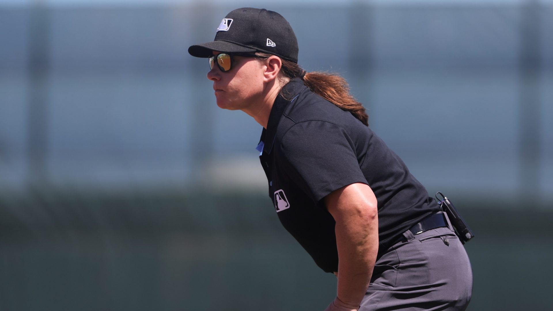 Mar 11, 2024; Jupiter, Florida, USA; MLB umpire Jen Pawol watches from first base during the game between the St. Louis Cardinals and the Washington Nationals at Roger Dean Chevrolet Stadium