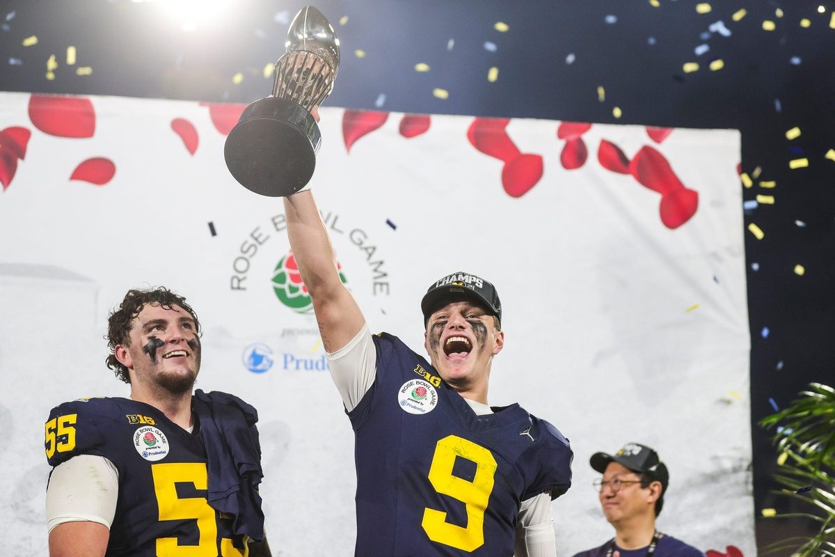 Michigan quarterback J.J. McCarthy lifts the Rose Bowl trophy to celebrate after the team's defeat of Alabama in the College Football Playoff semifinal at Rose Bowl Stadium in Pasadena, Calif., on Monday, Jan. 1, 2024.