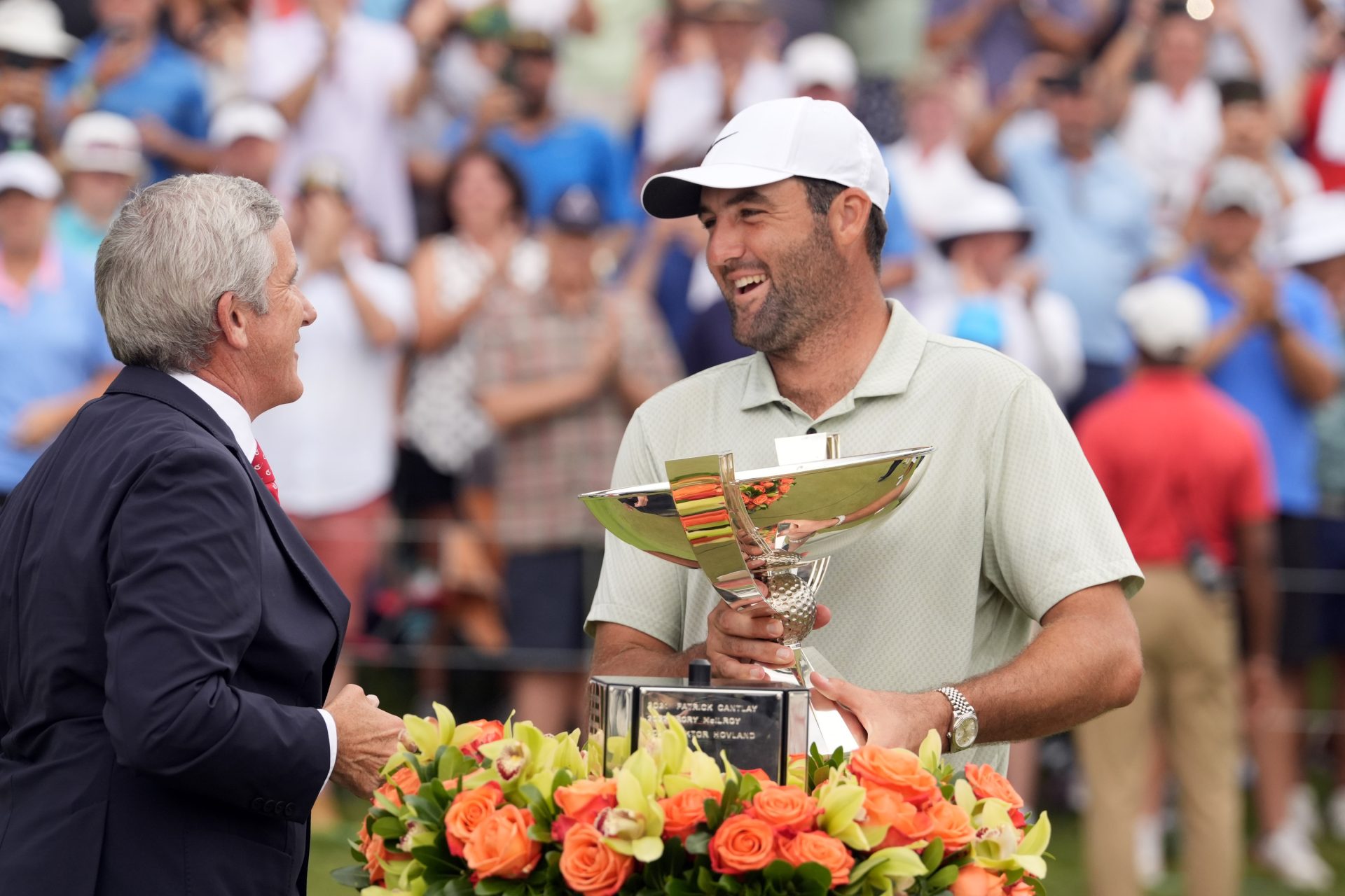 Sep 1, 2024; Atlanta, Georgia, USA; Sep 1, 2024; Atlanta, Georgia, USA; PGA TOUR Commissioner Jay Monahan presents Scottie Scheffler the FedEx Cup after winning the TOUR Championship golf tournament.