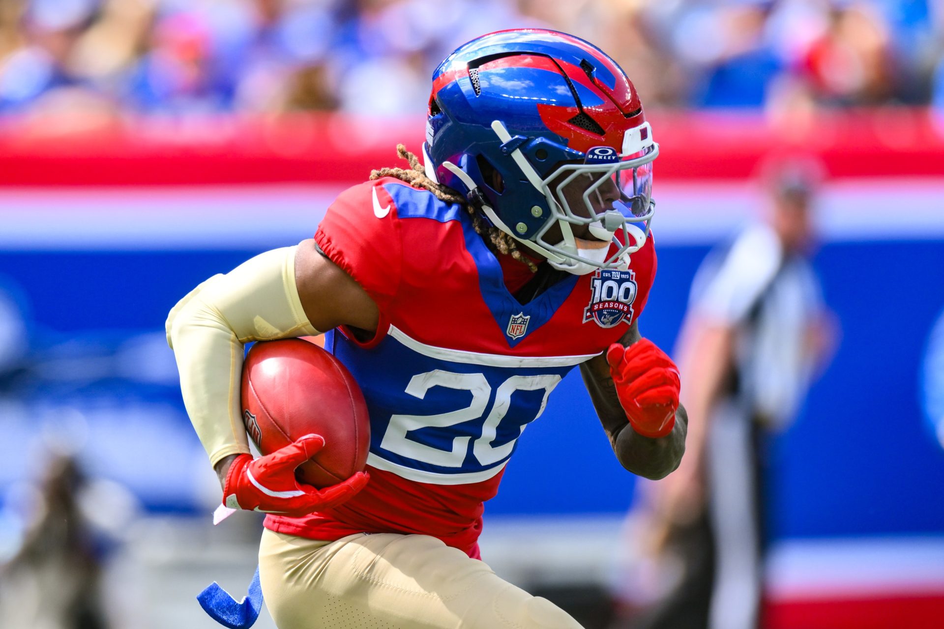 Sep 8, 2024; East Rutherford, New Jersey, USA; New York Giants running back Eric Gray (20) returns a kickoff against the Minnesota Vikings during the first half at MetLife Stadium.