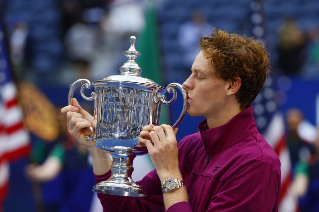 Sep 8, 2024; Flushing, NY, USA; Jannik Sinner (ITA) celebrates with the trophy after defeating Taylor Fritz (USA) in the men’s singles final of the 2024 U.S. Open tennis tournament at USTA Billie Jean King National Tennis Center.