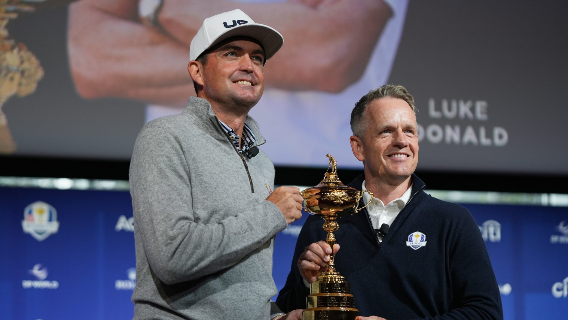 Oct 8, 2024; New York, New York, USA; US team captain Keegan Bradley, left, and Europe team captain Luke Donald take a photo with the Ryder Cup after a press conference at Times Center.