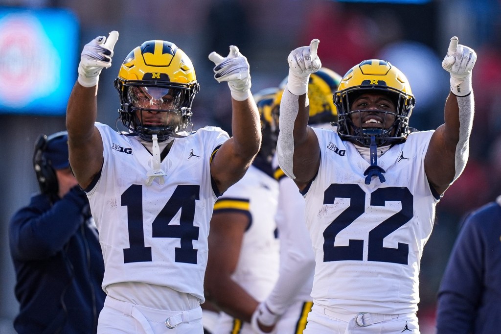 Michigan players wave at fans during the second half against Ohio State at Ohio Stadium in Columbus, Ohio on Saturday, Nov. 30, 2024.