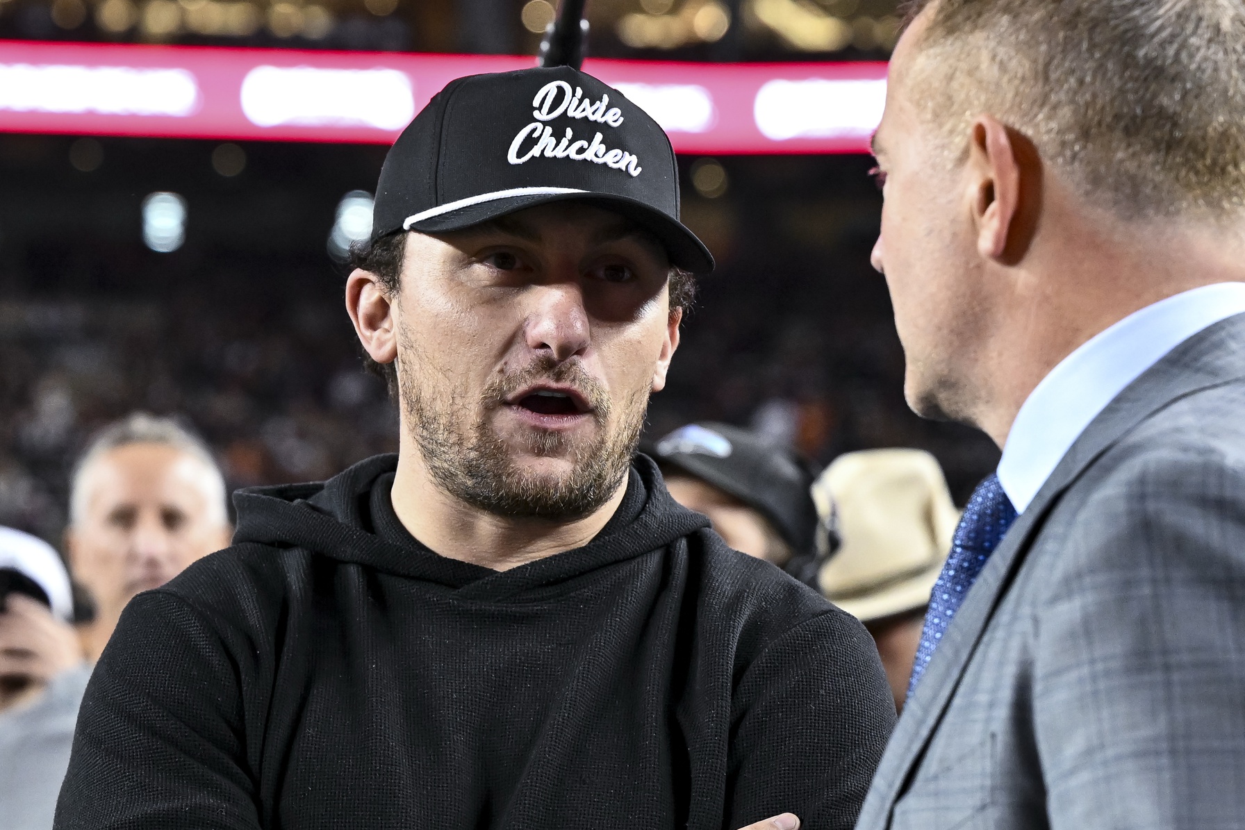 Nov 30, 2024; College Station, Texas, USA; Former Texas A&M and Cleveland Browns quarterback Johnny Manziel speaks with ESPN's College GameDay analyst Kirk Herbstreit prior to the game against the Texas Longhorns. The Longhorns defeated the Aggies 17-7 at Kyle Field.