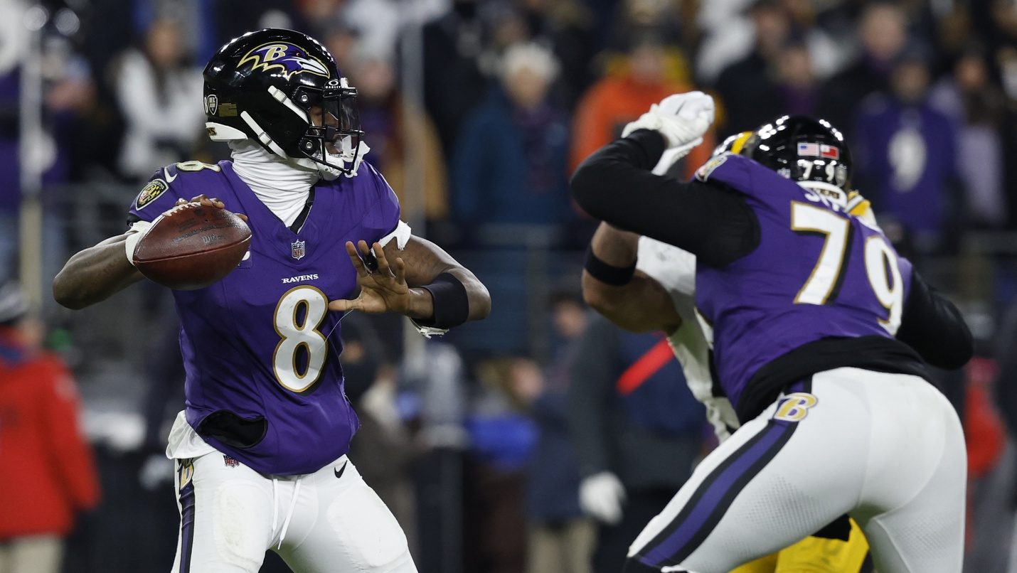 Jan 11, 2025; Baltimore, Maryland, USA; Baltimore Ravens quarterback Lamar Jackson (8) passes the ball against the Pittsburgh Steelers in an AFC wild card game at M&T Bank Stadium.