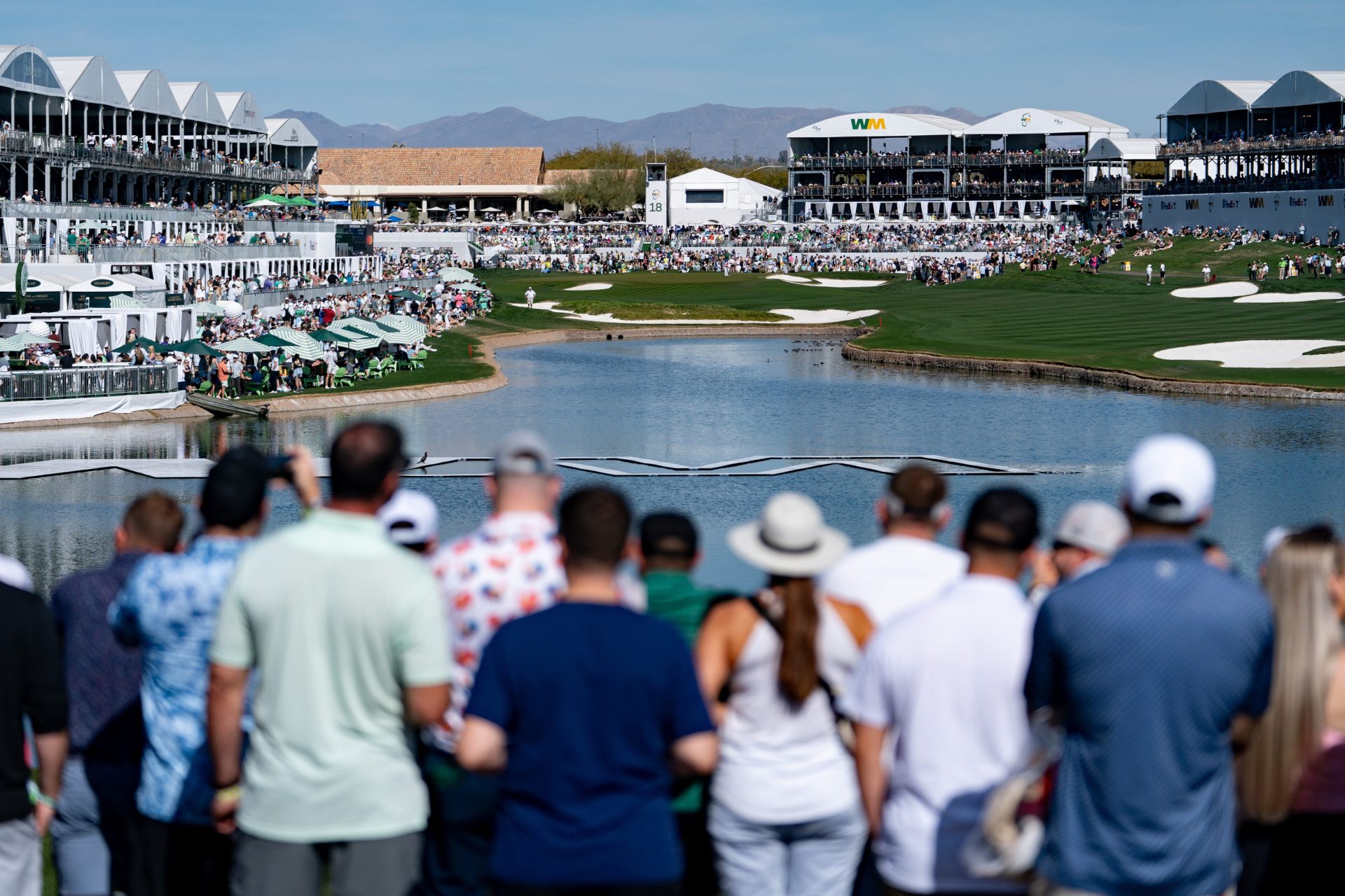 Fans watch as players make it into the 18th hole during round three of the Waste Management Phoenix Open at TPC in Scottsdale on Feb. 8, 2025. Arizona Republic