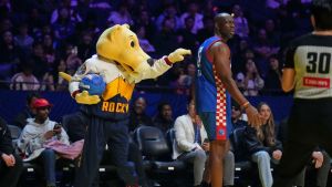 Feb 14, 2025; Oakland, California, USA; Denver Nuggets mascot Rocky the Mountain Lion gestures in front of Terrell Owens (81) of Team Rice during the celebrity game ahead of the 2025 NBA All Star Game at Oakland Arena.