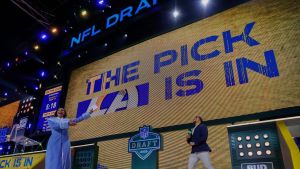 NFL Network host Kimmi Chex gives Indianapolis Colts running back Jonathan Taylor a draft do-over during the second round of the 2025 NFL Draft on Friday, April 25, 2025, at Lambeau Field in Green Bay, Wisconsin. Taylor was drafted in 2020 when the draft was held virtually due to COVID.