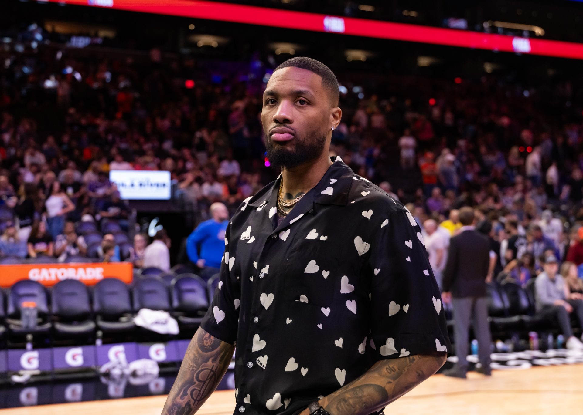 Mar 24, 2025; Phoenix, Arizona, USA; Milwaukee Bucks injured guard Damian Lillard against the Phoenix Suns at Footprint Center.