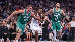 May 10, 2025; New York, New York, USA; Boston Celtics center Kristaps Porzingis (8), and forward Jayson Tatum (0) and New York Knicks forward OG Anunoby (8) during game three of the second round for the 2025 NBA Playoffs at Madison Square Garden.