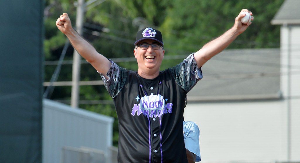 John Oliver, host of HBO show Last Week Tonight with John Oliver throws out the first pitch during the first of four promotional baseball games in Erie on July 19, 2025. The Erie SeaWolves, a Double-A Minor League Baseball team affiliate of the Detroit Tigers, are temporarily rebranding as the Erie Moon Mammoths for four games this year as part of a promotional collaboration with HBOs Last Week Tonight with John Oliver