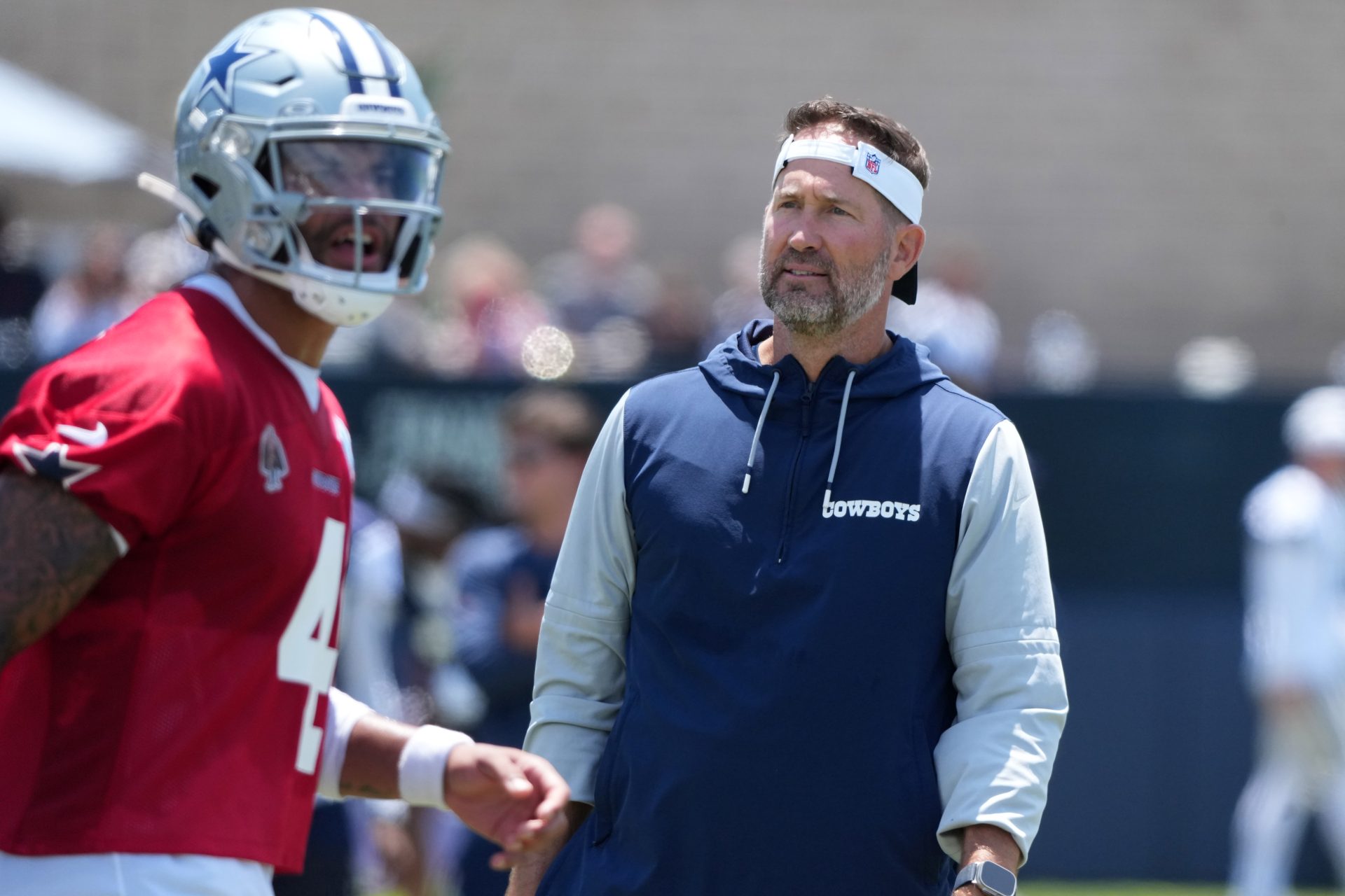 Jul 26, 2025; Oxnard, CA, USA; Dallas Cowboys coach Brian Schottenheimer watches quarterback Dak Prescott (4) at training camp at the River Ridge Fields.