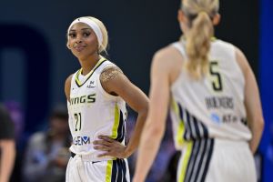 Jul 28, 2025; Arlington, Texas, USA; Dallas Wings guard Paige Bueckers (5) and guard DiJonai Carrington (21) during the game between the Dallas Wings and the New York Liberty at College Park Center.