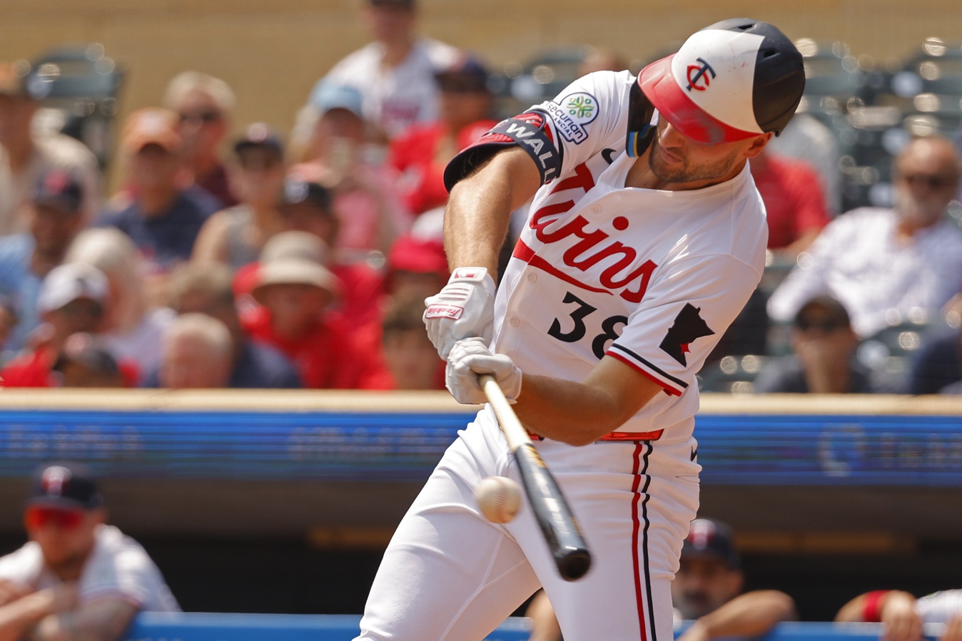 Jul 30, 2025; Minneapolis, Minnesota, USA; Minnesota Twins right fielder Matt Wallner (38) hits a solo home run against the Boston Red Sox in the second inning at Target Field.