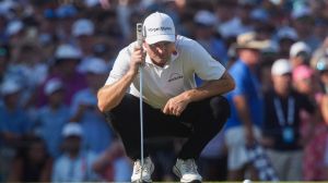 Justin Rose lines up a putt on the 18th hole during the final round of the FedEx St. Jude Championship at TPC Southwind in Memphis, Tenn., on August 10, 2025.
