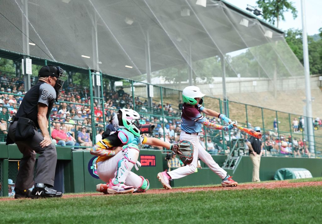 Braintree American batter Ryan Fennell hits the ball against Southeast pitcher Brody Miller during the Little League Baseball World Series at South Williamsport, PA on Thursday, Aug. 13, 2025.