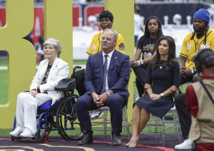 Oct 27, 2024; Houston, Texas, USA; Houston Texans co-founder and former owner Janice McNair (left) sits with Texans chief executive officer Cal McNair and wife Hannah McNair in front of family members of Texans former player Andre Johnson (not pictured) during a ceremony at halftime of the game against the Indianapolis Colts at NRG Stadium.