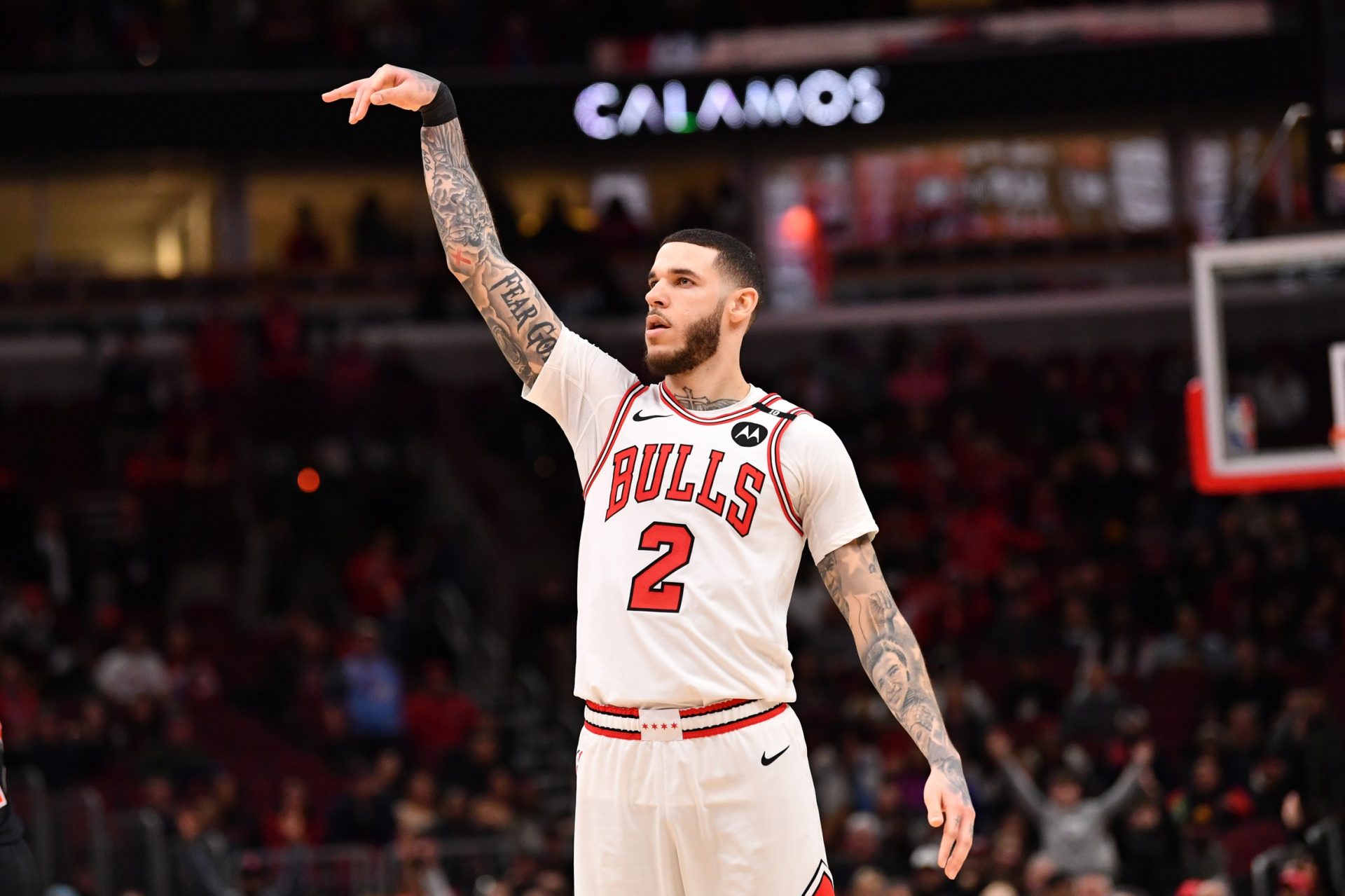 Feb 28, 2025; Chicago, Illinois, USA; Chicago Bulls forward Lonzo Ball (2) hits a three point shot against Toronto Raptors guard Jamal Shead (23) during overtime at the United Center.